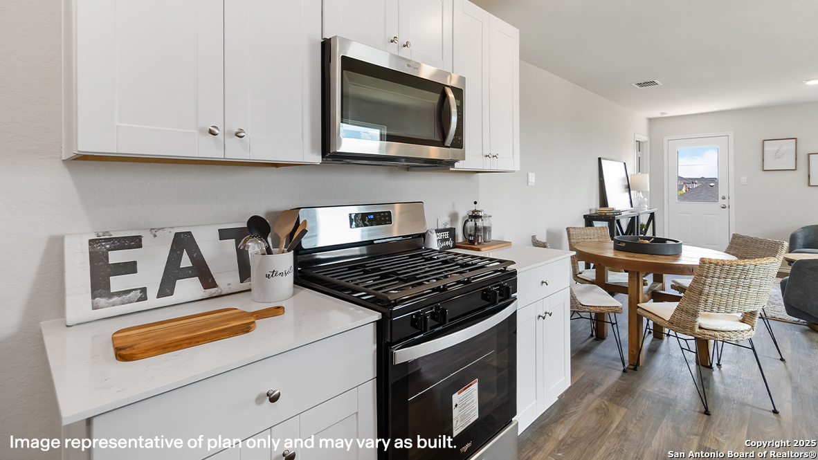 5320 Blacktail Road Converse, TX 78109 - Photo 5 of 50 a kitchen with stainless steel appliances granite countertop a stove and a microwave