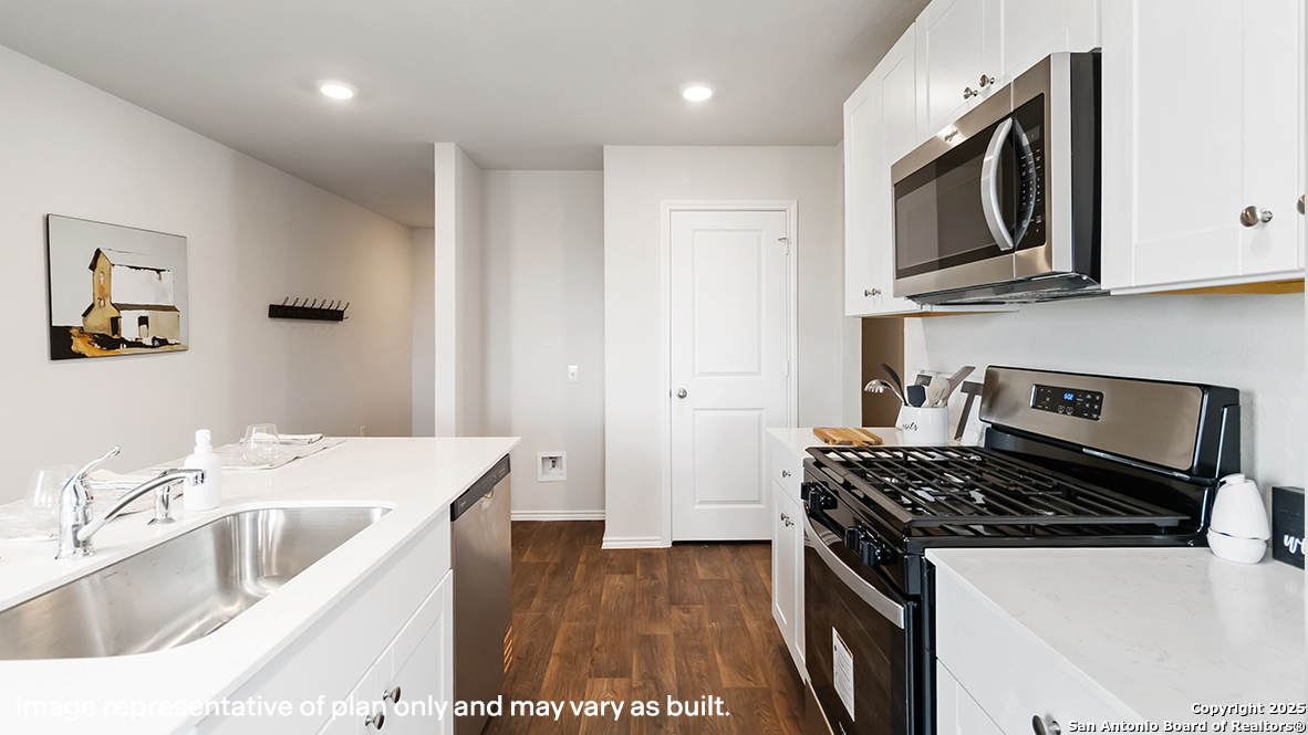 5320 Blacktail Road Converse, TX 78109 - Photo 10 of 50 a kitchen with stainless steel appliances granite countertop a sink stove and refrigerator
