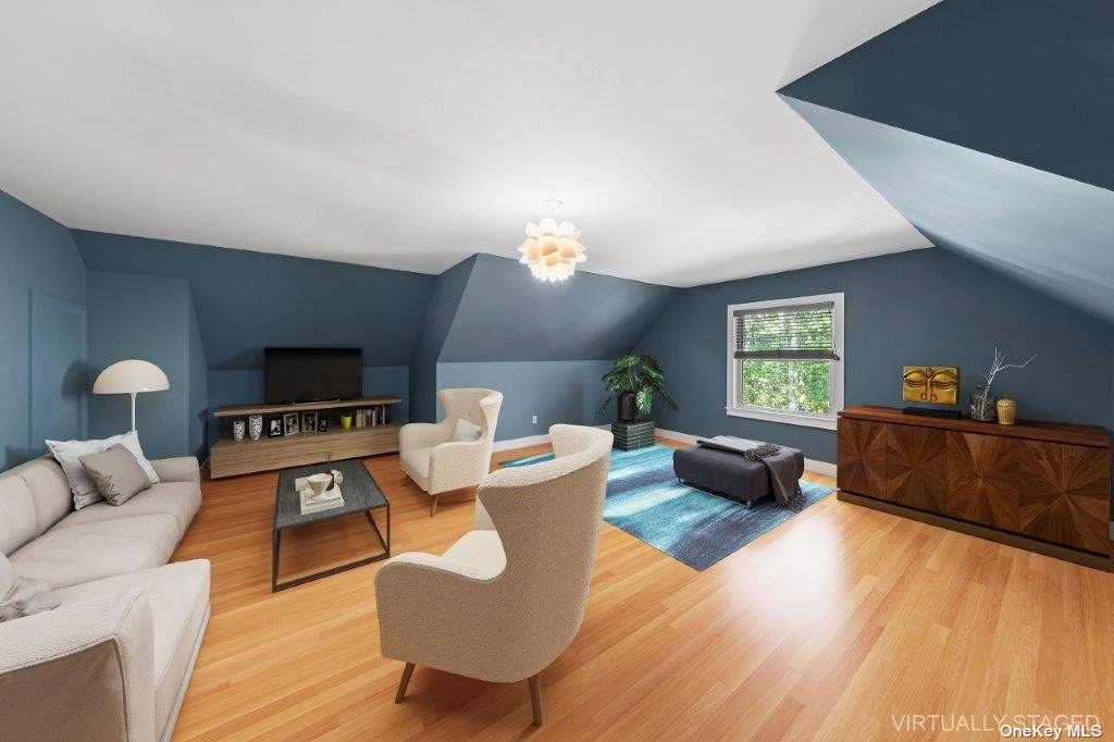 4 East Hampton, undefined 00000 - Photo 16 of 20 a living room with furniture a window and a flat screen tv