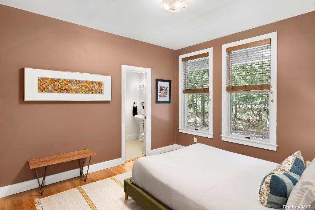 4 East Hampton, undefined 00000 - Photo 18 of 20 a bedroom with a bed and a window