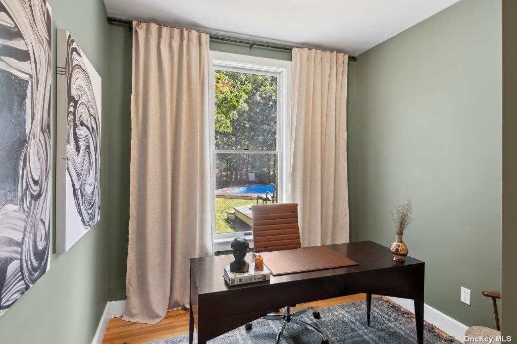 4 East Hampton, undefined 00000 - Photo 4 of 20 a view of a workspace with a window and chair