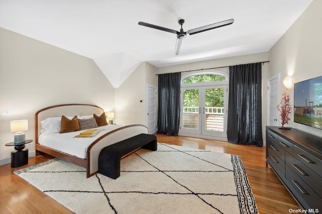 4 East Hampton, undefined 00000 - Photo 5 of 20 a bedroom with a bed and a large window