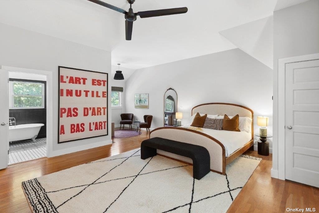 4 East Hampton, undefined 00000 - Photo 6 of 20 a bedroom with a bed and a table