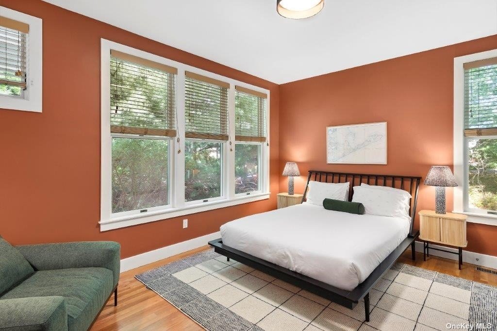 4 East Hampton, undefined 00000 - Photo 8 of 20 a bedroom with a large bed and a large window