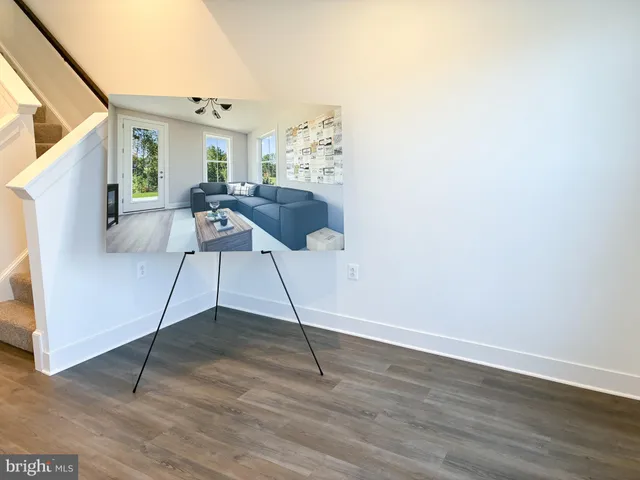 a workspace with furniture and a potted plant
