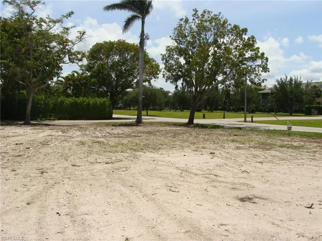 a view of outdoor space with deck and trees