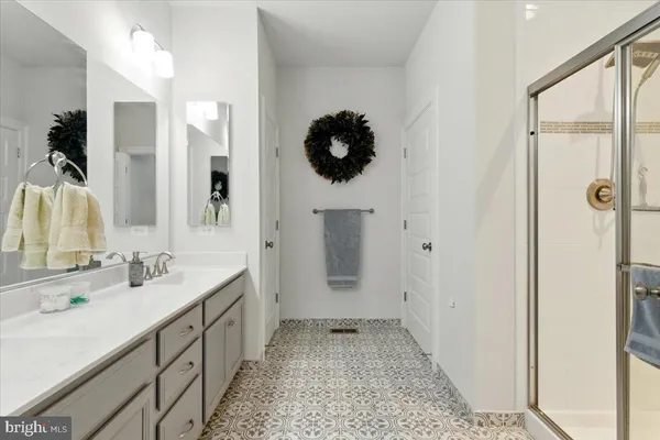 a bathroom with a sink and mirror