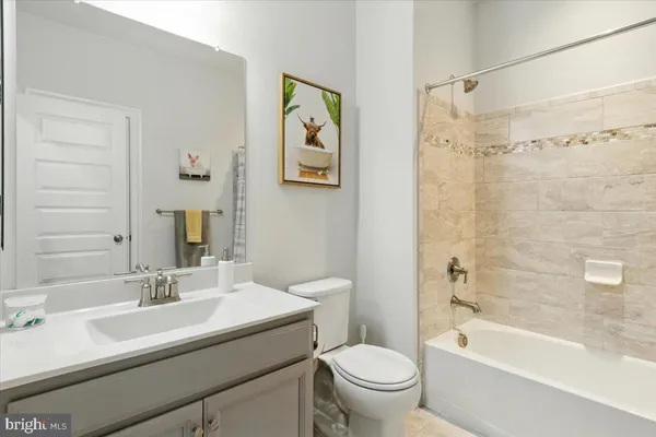 a bathroom with a sink a toilet and a bathtub