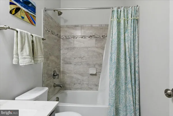 a bathroom with a bathtub and shower