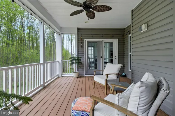 a view of an house with backyard space and balcony