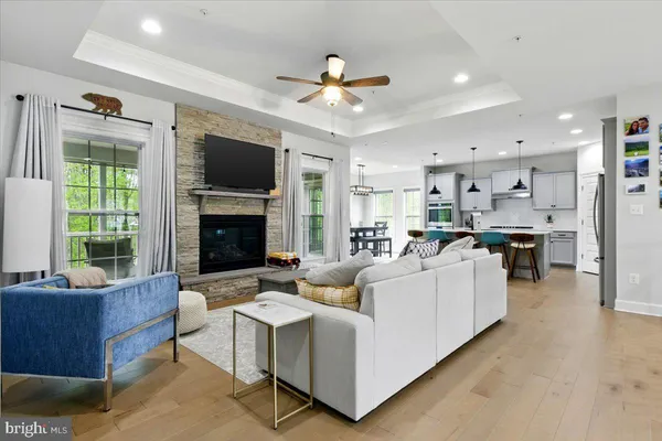 a living room with furniture fireplace and flat screen tv