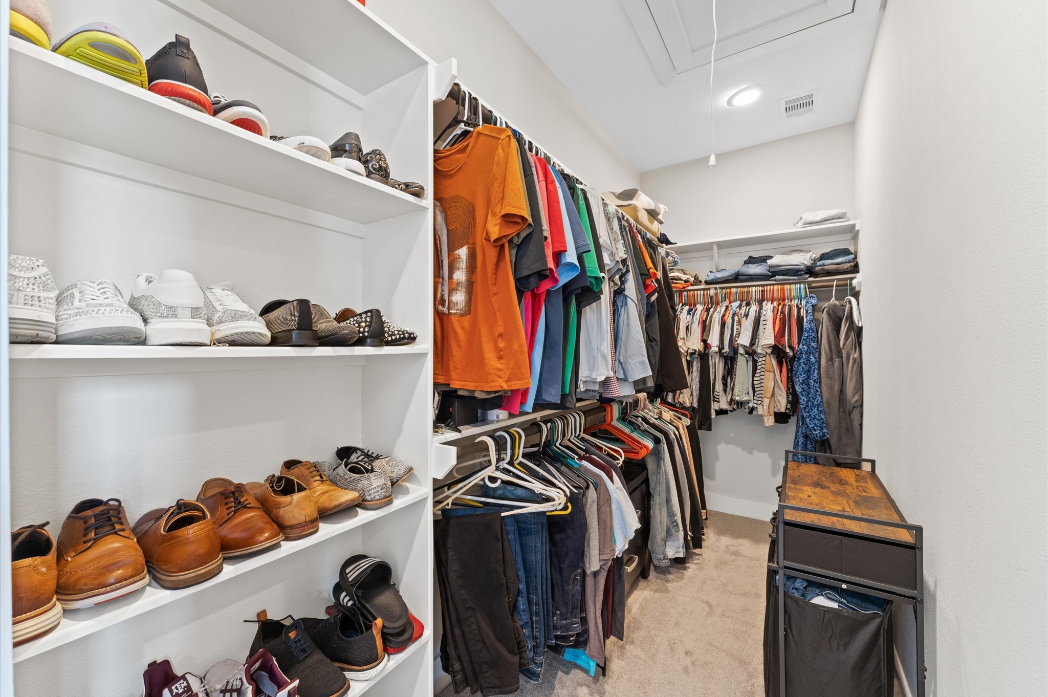 2422 Cochran Street Houston, TX 77009 - Photo 20 of 31 A large walk-in closet includes shelving for shoes or bags and plenty of space for hanging clothes.