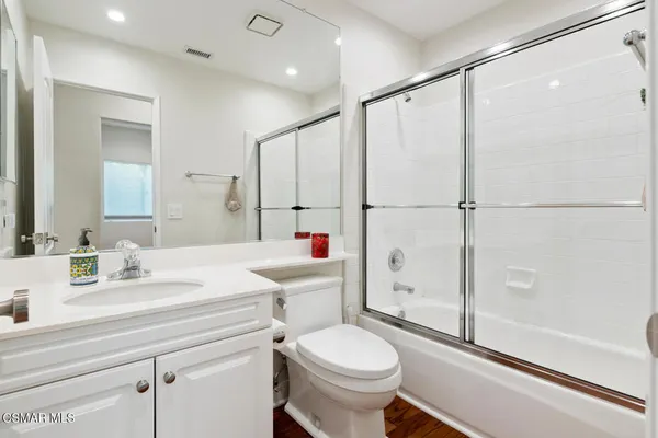 a bathroom with a sink toilet and a shower