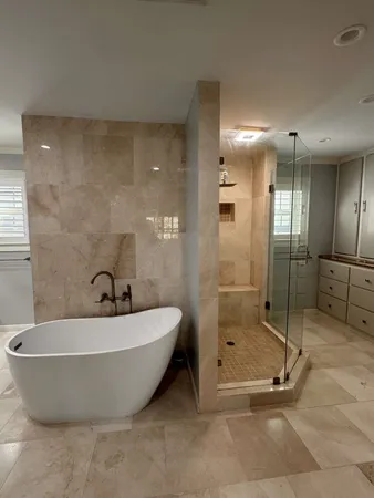 an empty room with a flat screen tv and a fireplace