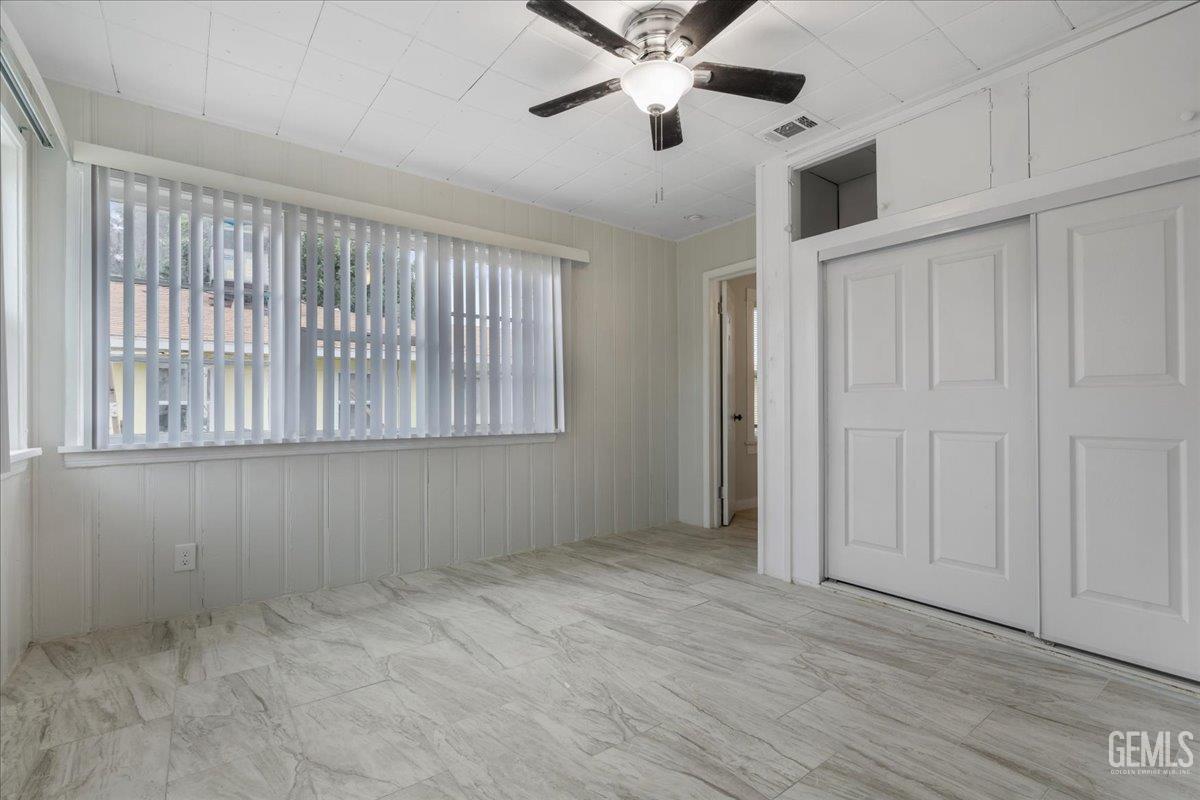 Undisclosed Address Bakersfield, CA 93304 - Photo 12 of 21 a view of an empty room with a window