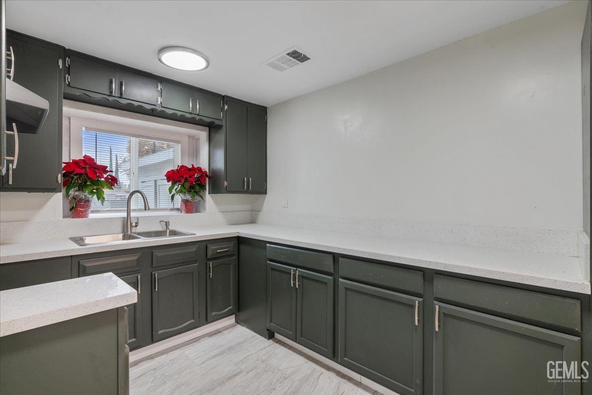 Undisclosed Address Bakersfield, CA 93304 - Photo 16 of 21 a kitchen with sink cabinets and window