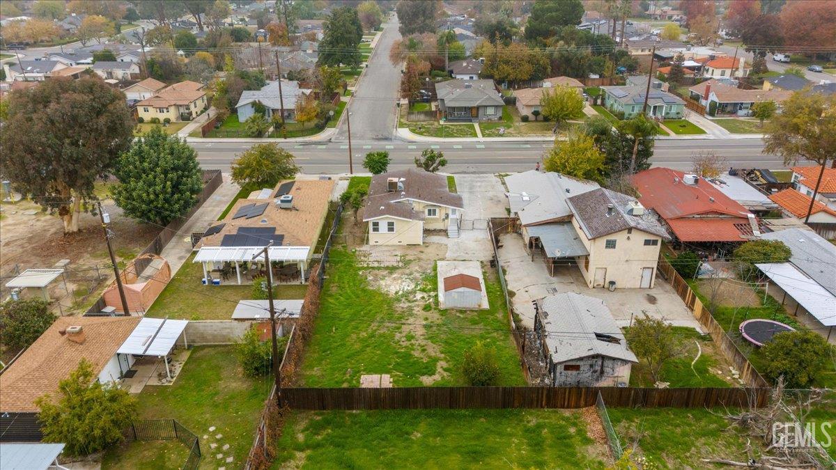 Undisclosed Address Bakersfield, CA 93304 - Photo 21 of 21 an aerial view of residential houses with outdoor space and parking