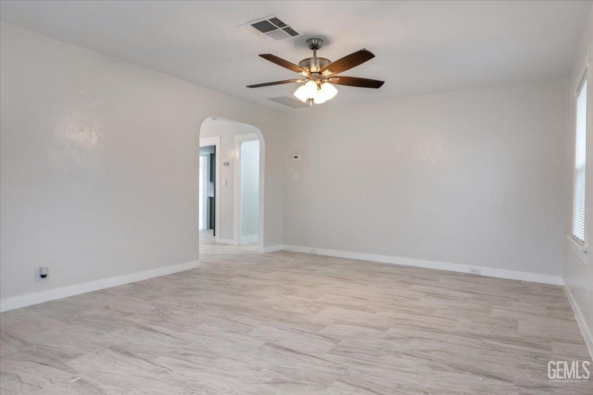 Undisclosed Address Bakersfield, CA 93304 - Photo 3 of 21 a view of an empty room with a fan