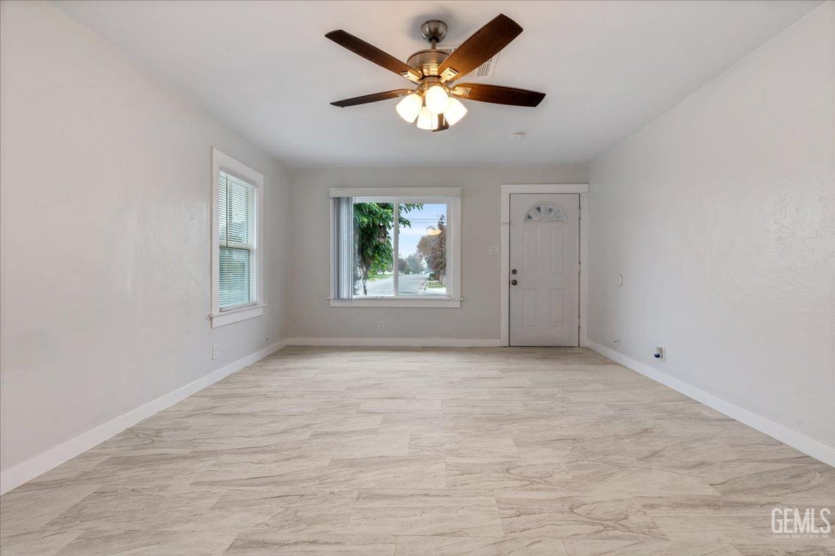 Undisclosed Address Bakersfield, CA 93304 - Photo 5 of 21 a view of an empty room with a window