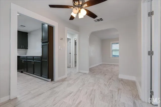 a view of a kitchen with a sink and cabinet area
