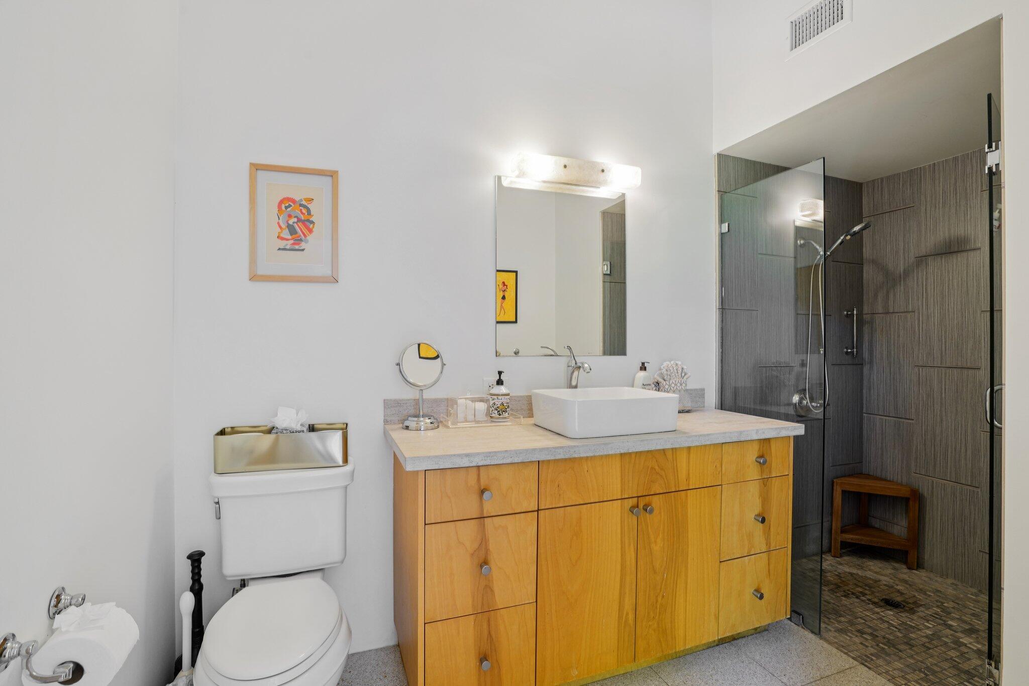 788 North Dry Falls Road Palm Springs, CA 92262 - Photo 27 of 97 a bathroom with a toilet sink vanity and mirror