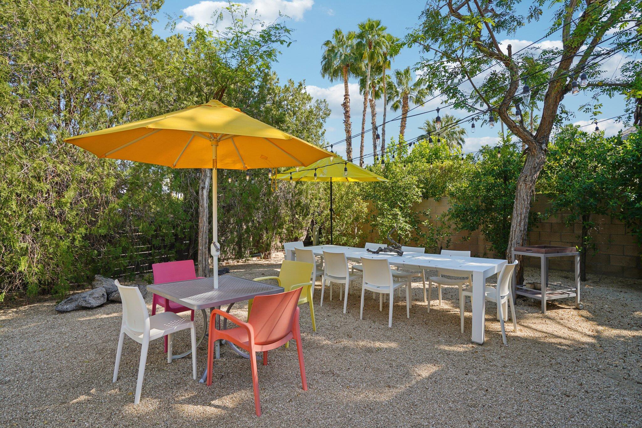 788 North Dry Falls Road Palm Springs, CA 92262 - Photo 50 of 97 a view of a tables and chairs under an umbrella