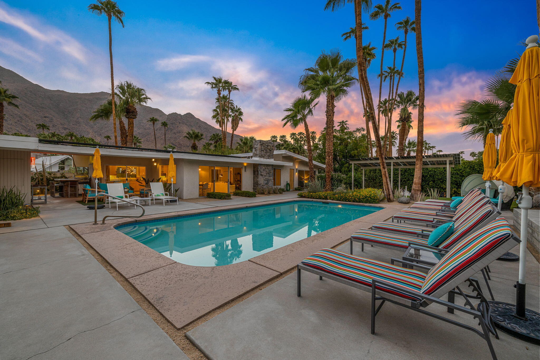 788 North Dry Falls Road Palm Springs, CA 92262 - Photo 54 of 97 a view of swimming pool with a bench and palm trees
