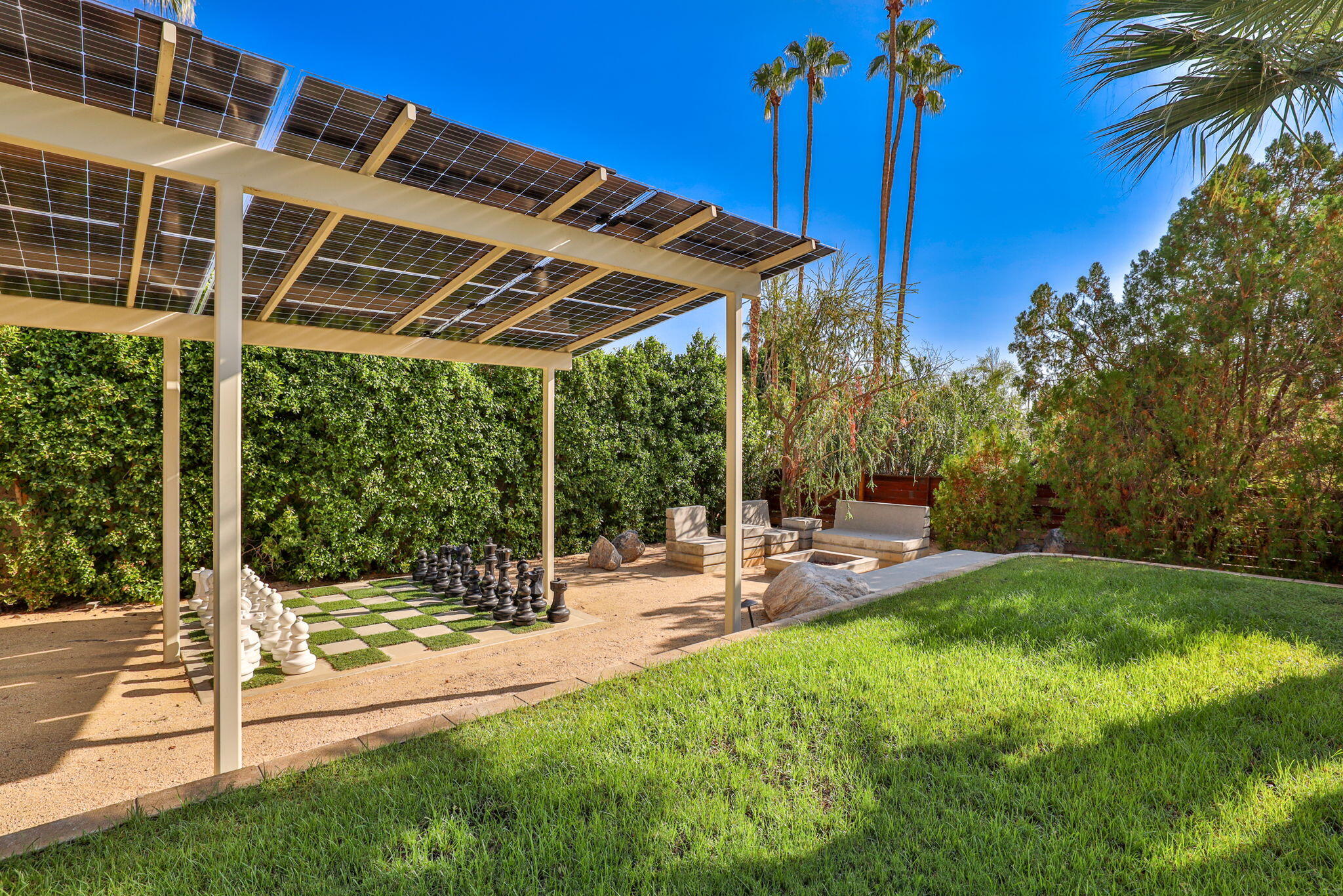 788 North Dry Falls Road Palm Springs, CA 92262 - Photo 71 of 97 a view of a patio with a table and chairs under an umbrella