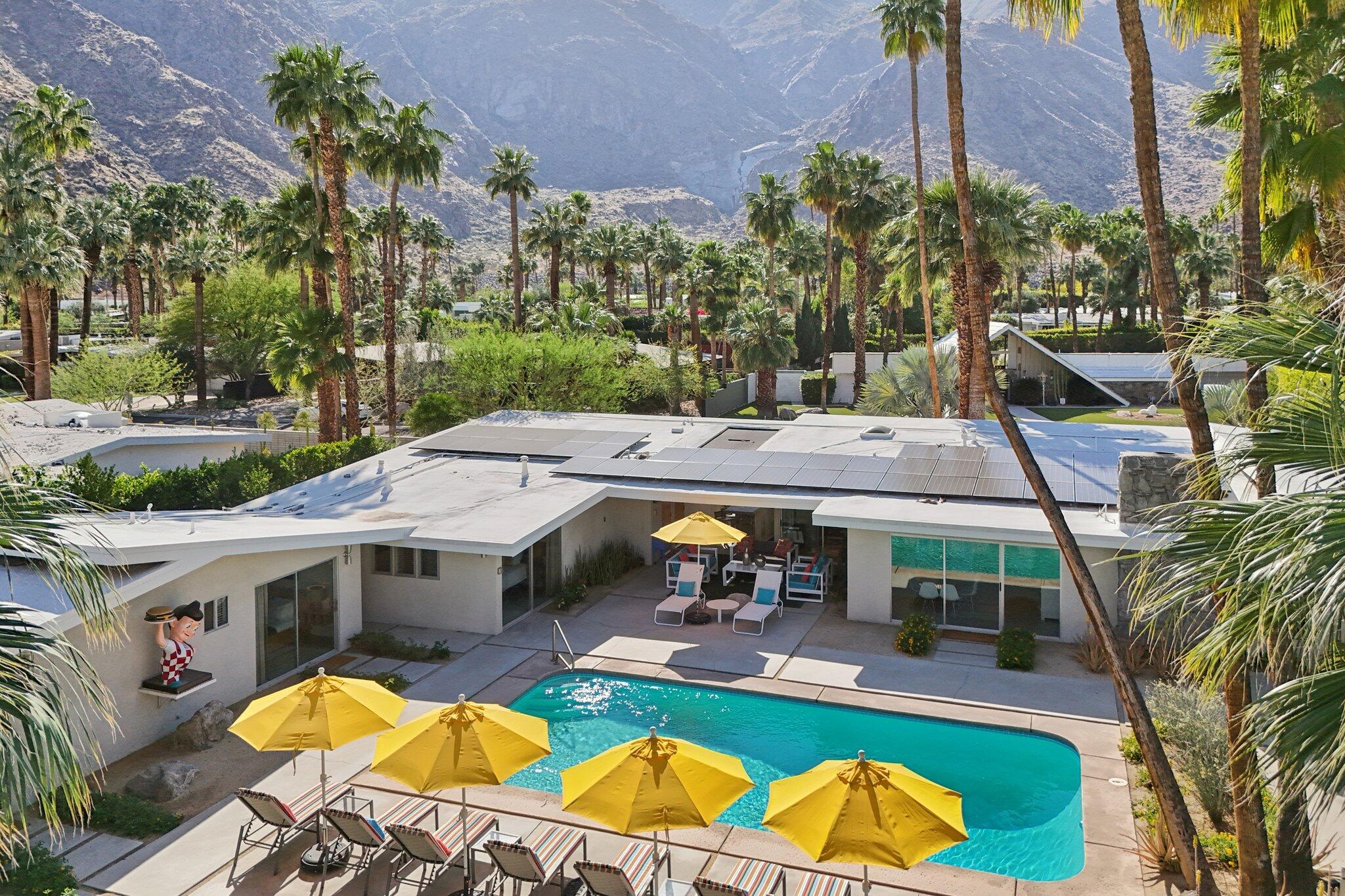 788 North Dry Falls Road Palm Springs, CA 92262 - Photo 96 of 97 an aerial view of a house with swimming pool lawn chairs and a fire pit