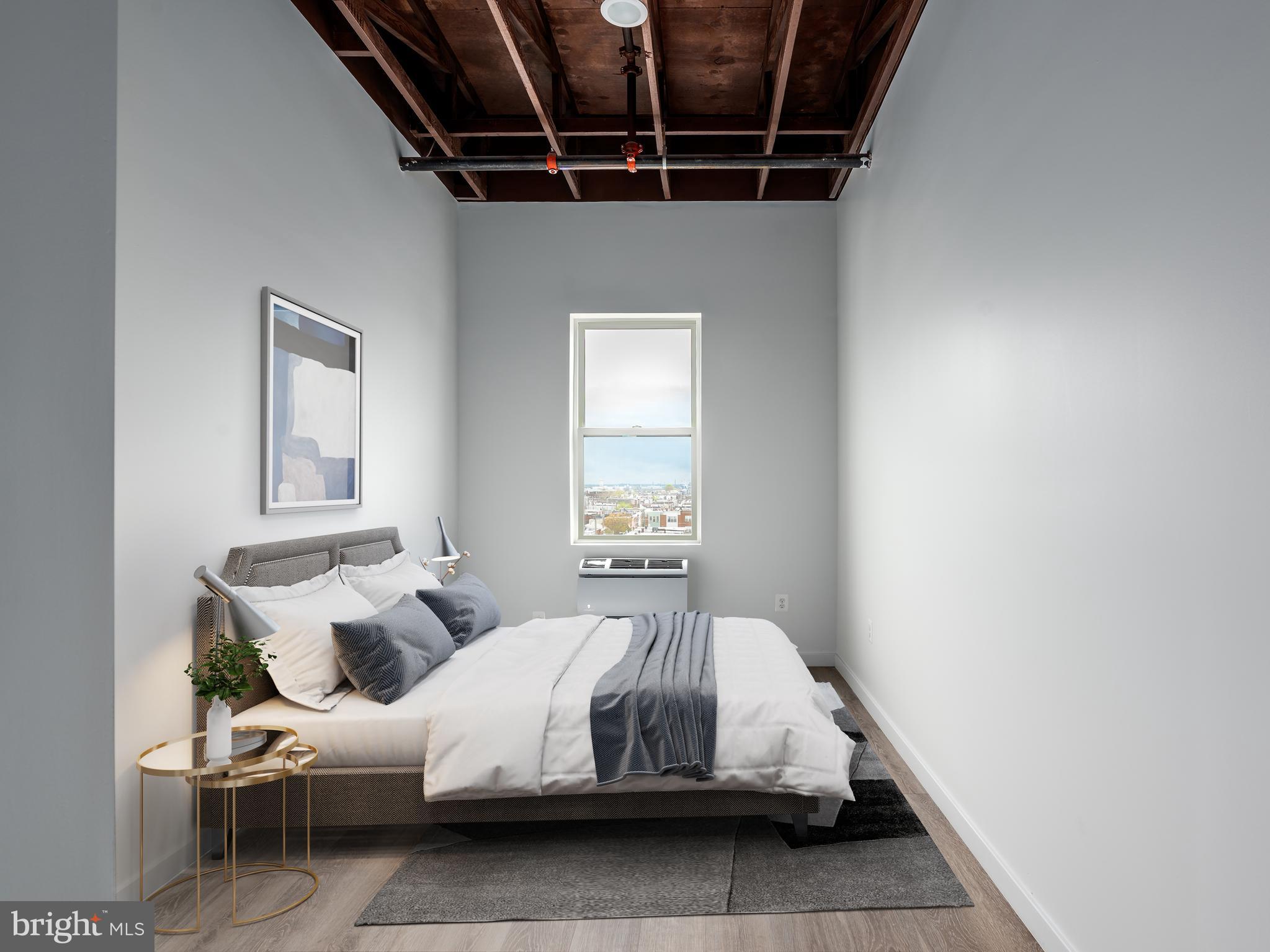 1201 Jackson Street, Unit 428 Philadelphia, PA 19148 - Photo 45 of 46 a bed room with a bed and a window