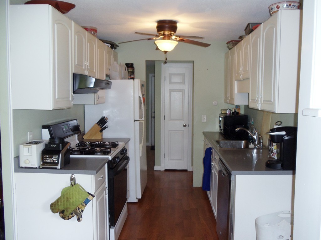 14 Naushon Road Wareham, MA 02576 - Photo 13 of 17 a kitchen with stainless steel appliances a stove a refrigerator and a refrigerator
