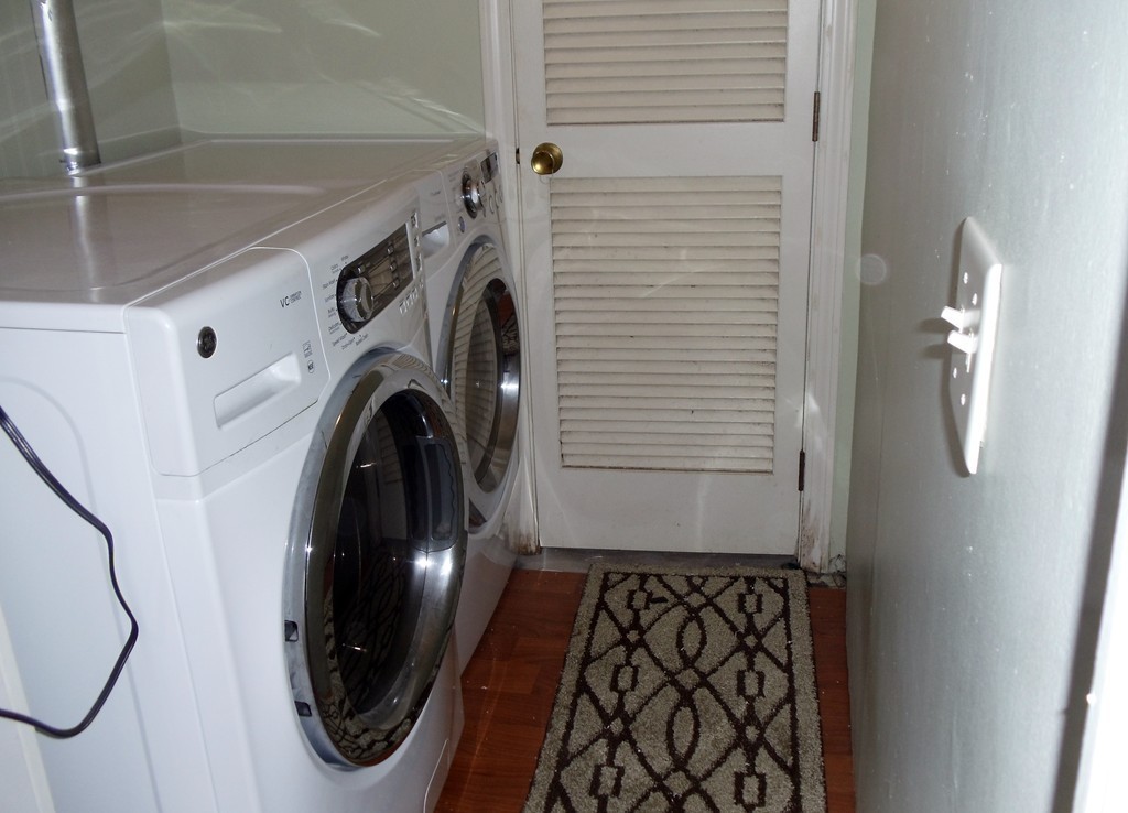 14 Naushon Road Wareham, MA 02576 - Photo 14 of 17 a view of a hallway with washer and dryer