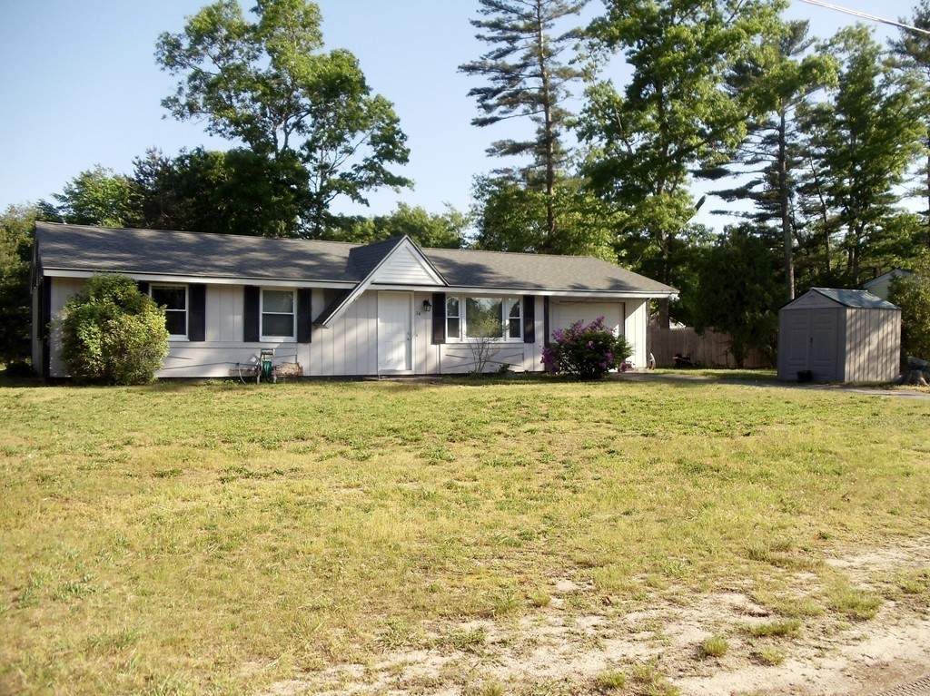 14 Naushon Road Wareham, MA 02576 - Photo 3 of 17 a front view of house with yard and trees around