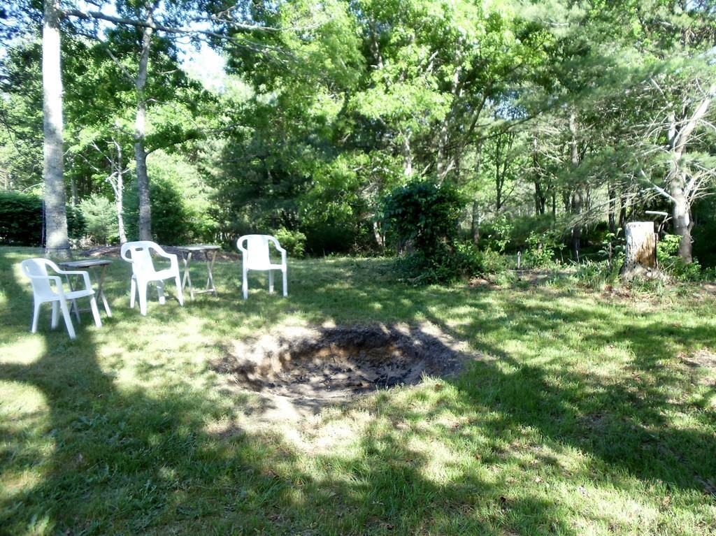 14 Naushon Road Wareham, MA 02576 - Photo 8 of 17 a view of a chair and table in the yard