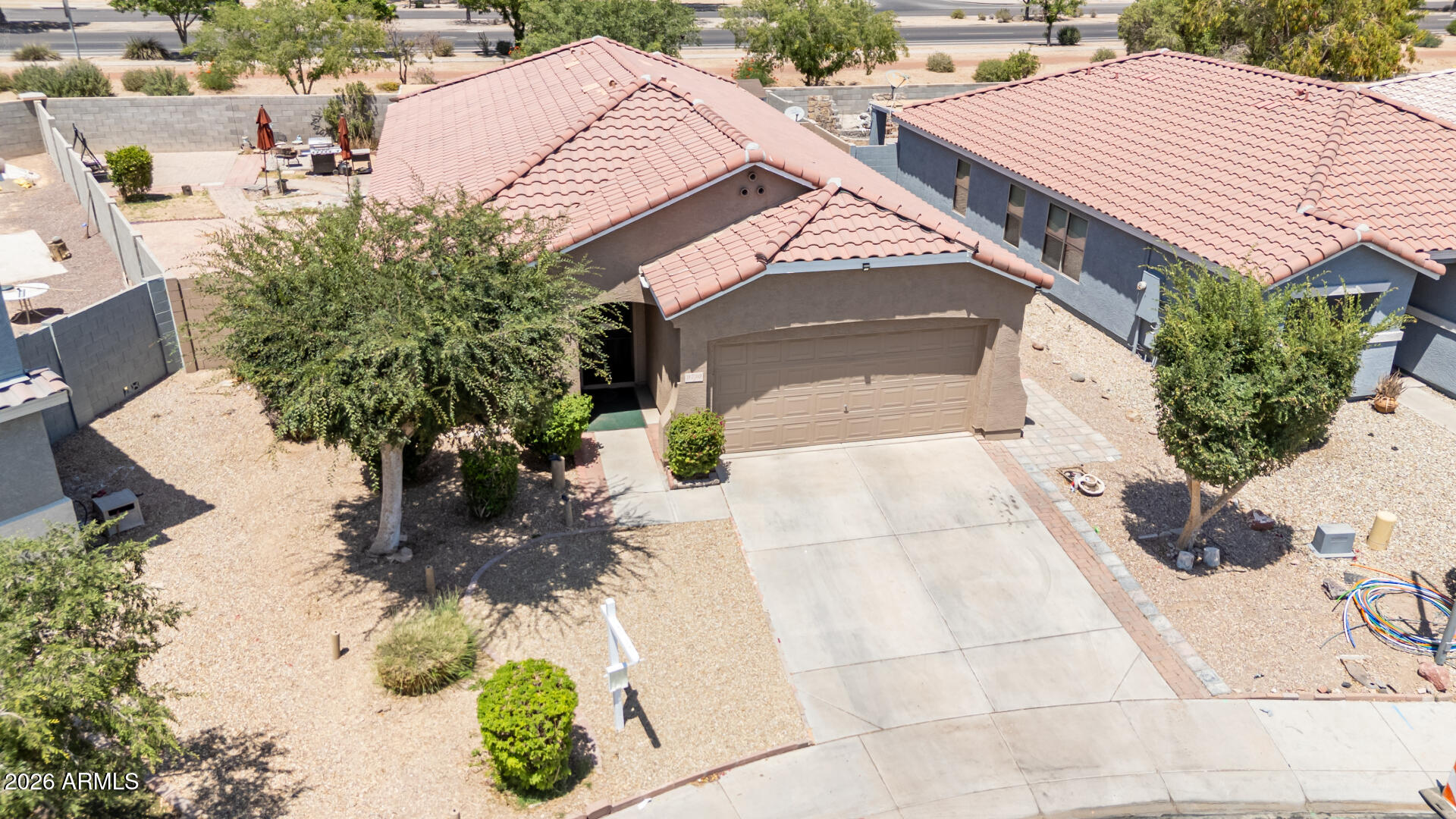 9730 West Payson Road Tolleson, AZ 85353 - Photo 33 of 57 a view of a house with a yard