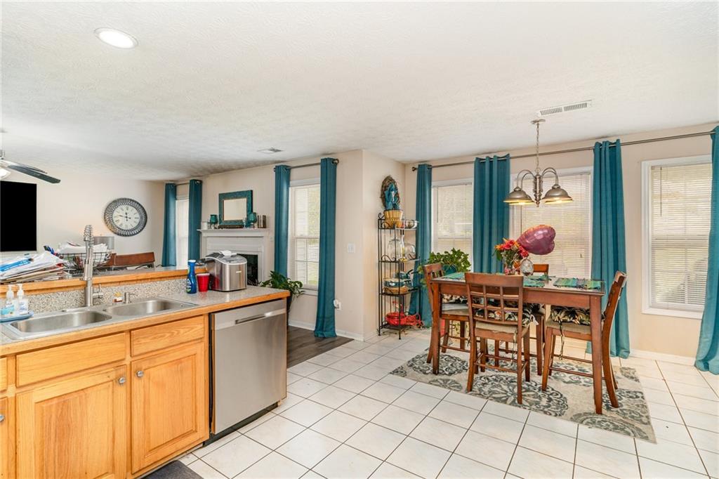 40 Cindy Circle Covington, GA 30016 - Photo 14 of 34 a kitchen with stainless steel appliances a sink and cabinets