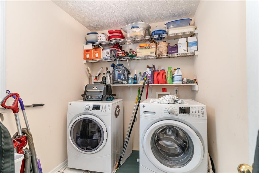 40 Cindy Circle Covington, GA 30016 - Photo 16 of 34 a utility room with dryer and washer