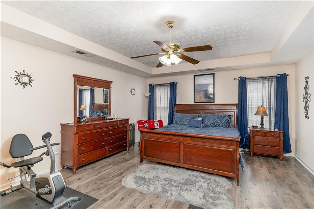 40 Cindy Circle Covington, GA 30016 - Photo 18 of 34 a room with a bed and a chandelier