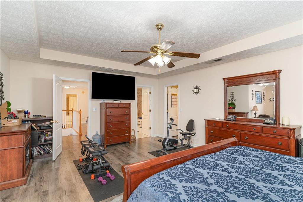 40 Cindy Circle Covington, GA 30016 - Photo 19 of 34 a living room with furniture flat screen tv and a fireplace