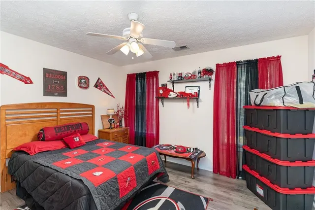 a bedroom with a bed and a closet