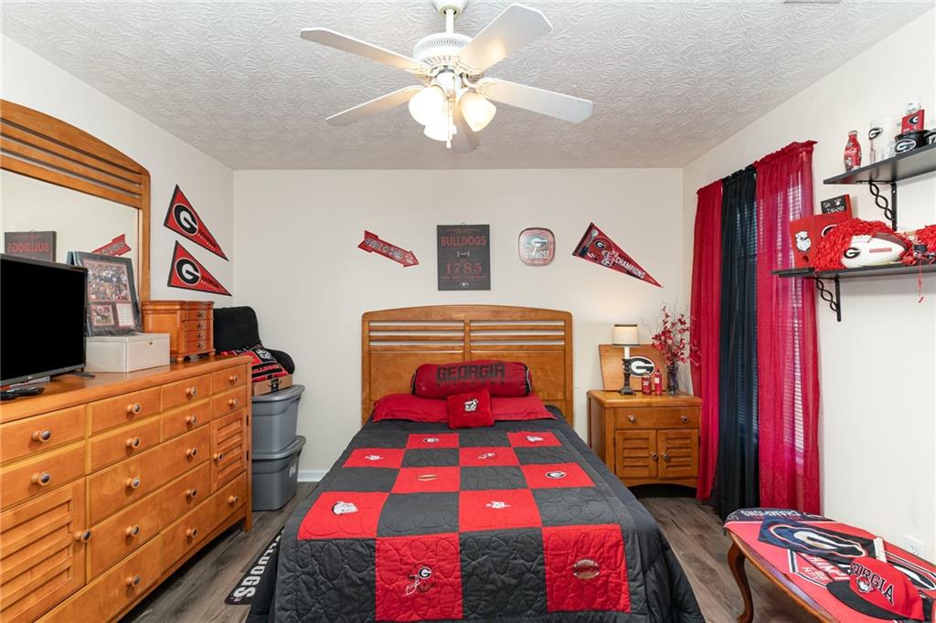 40 Cindy Circle Covington, GA 30016 - Photo 28 of 34 a bedroom with a bed and a dresser in it