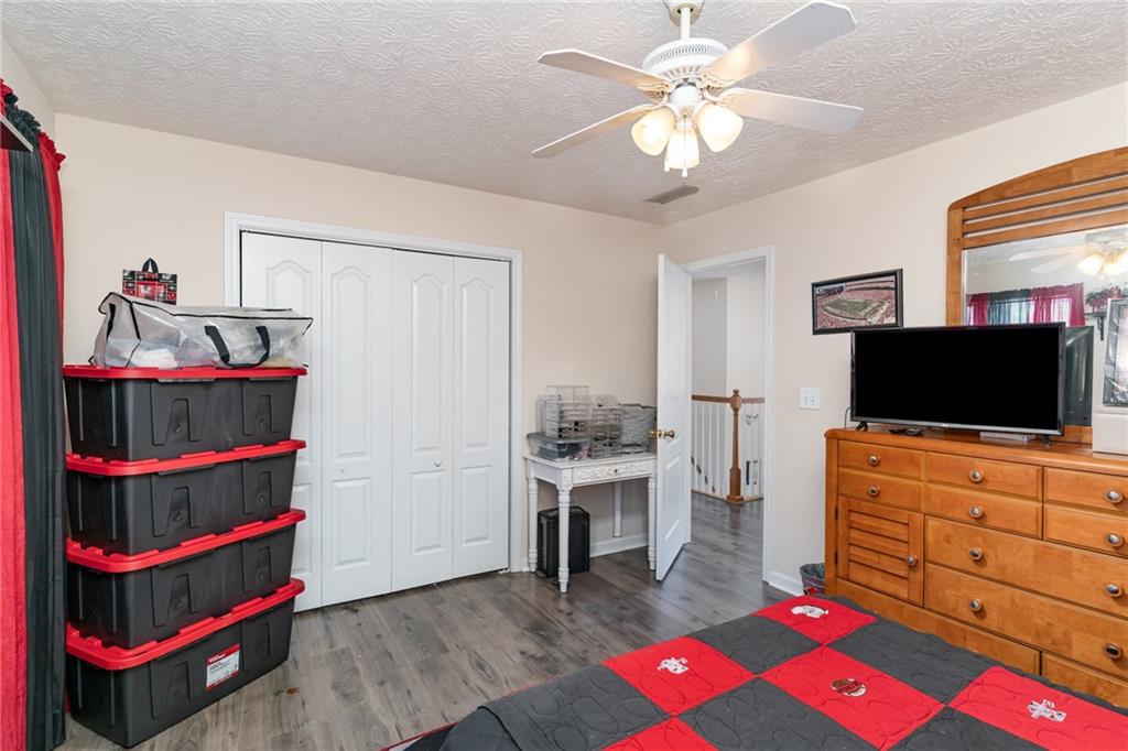 40 Cindy Circle Covington, GA 30016 - Photo 29 of 34 a living room with furniture and a flat screen tv