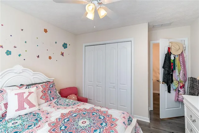 a bedroom with a bed and a closet