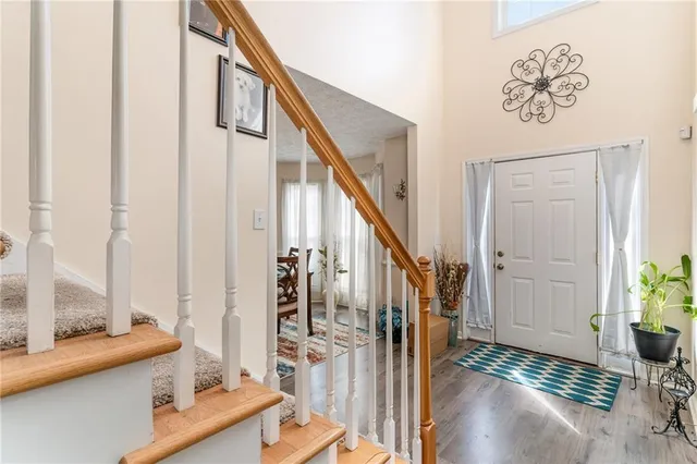 a view of front door with furniture and rug