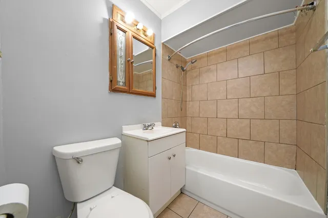 a bathroom with a toilet a sink and bathtub