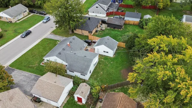 an aerial view of a house with a garden