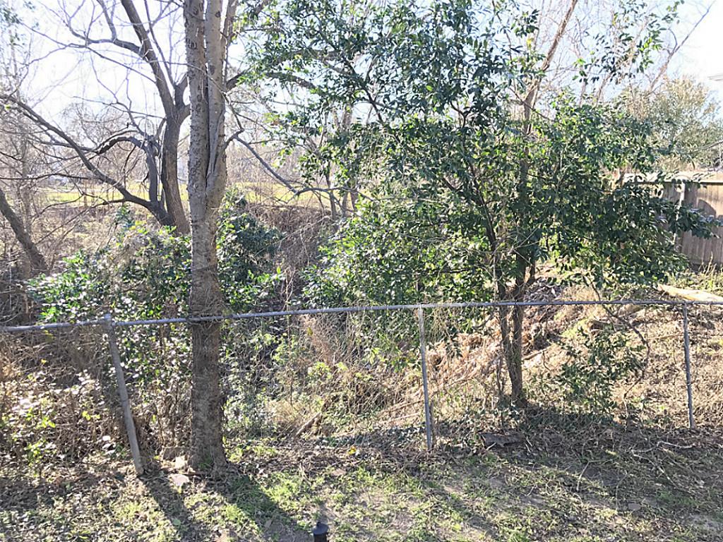 531 Threlkeld Street Houston, TX 77007 - Photo 15 of 15 a view of a lake with a tree
