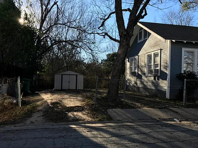 a view of a back yard of the house