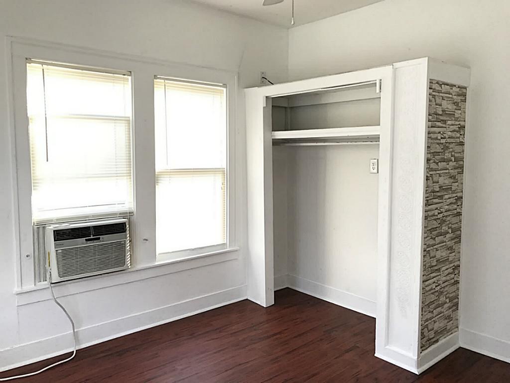 531 Threlkeld Street Houston, TX 77007 - Photo 9 of 15 a room with a wooden floor and a window
