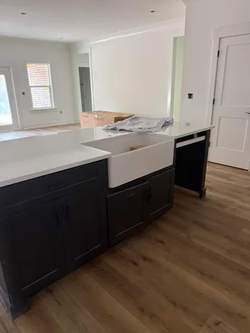 a bathroom with a sink vanity and a mirror